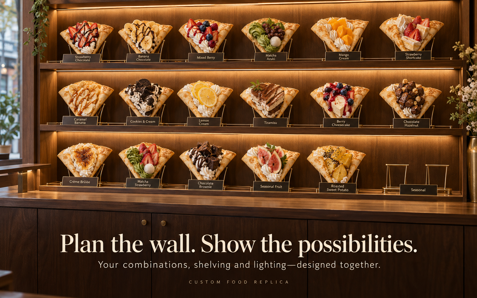 Three tier lit wooden wall of labeled crepe replicas with an empty seasonal slot on the bottom shelf
