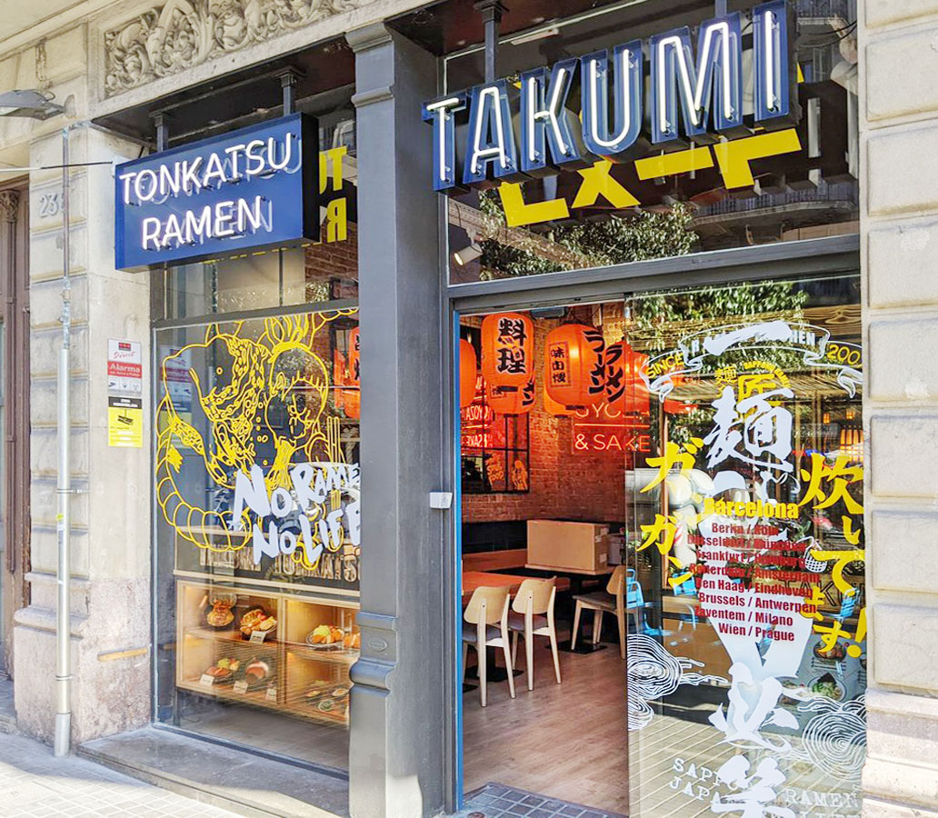 Close-up of a glazed tonkatsu and ramen food replica in a shop window, showing the gloss and texture a camera needs