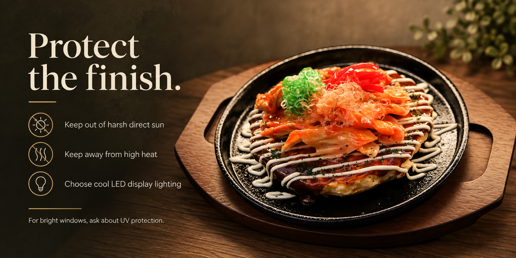 Protect the finish graphic beside an okonomiyaki food replica: keep out of harsh sun, away from high heat, use cool LED lighting